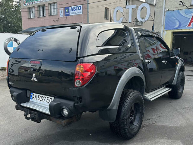 Черный Мицубиси Л 200, объемом двигателя 2.48 л и пробегом 210 тыс. км за 16500 $, фото 4 на Automoto.ua