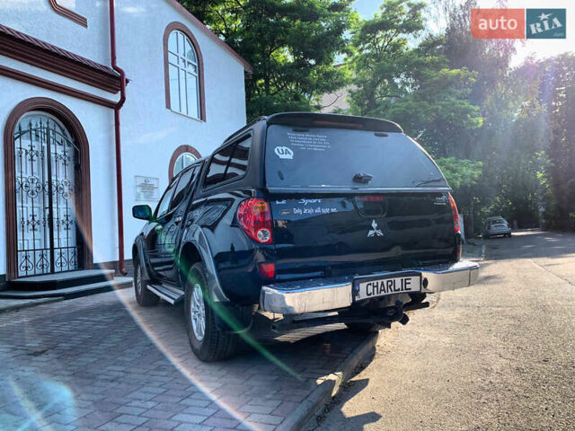 Черный Мицубиси Л 200, объемом двигателя 2.5 л и пробегом 221 тыс. км за 12800 $, фото 7 на Automoto.ua