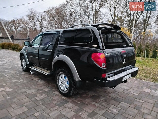 Чорний Міцубісі Л 200, об'ємом двигуна 2.48 л та пробігом 219 тис. км за 10500 $, фото 9 на Automoto.ua
