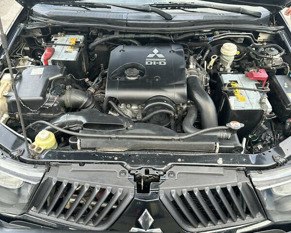 Черный Мицубиси Л 200, объемом двигателя 2.48 л и пробегом 210 тыс. км за 16500 $, фото 10 на Automoto.ua