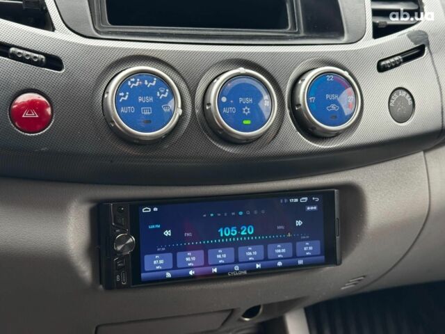 Чорний Міцубісі Л 200, об'ємом двигуна 2.5 л та пробігом 330 тис. км за 9890 $, фото 14 на Automoto.ua