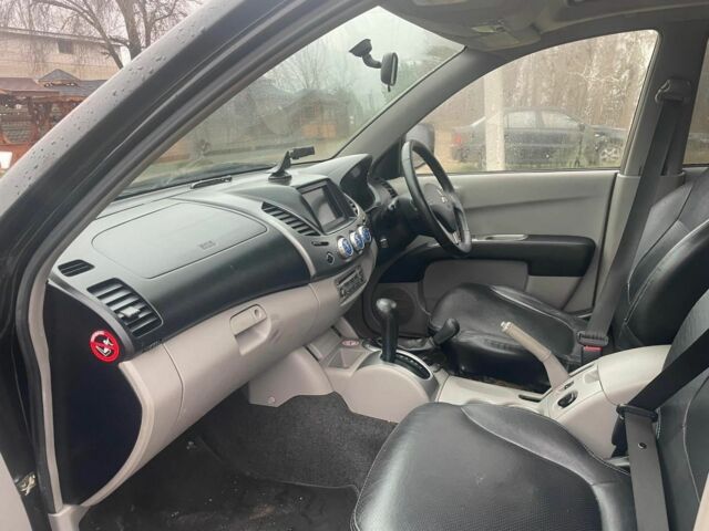 Черный Мицубиси Л 200, объемом двигателя 2.5 л и пробегом 145 тыс. км за 6800 $, фото 18 на Automoto.ua