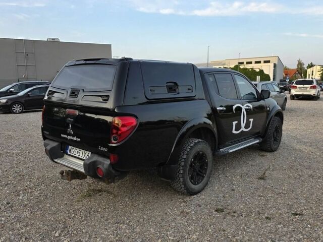 Черный Мицубиси Л 200, объемом двигателя 2.5 л и пробегом 213 тыс. км за 3006 $, фото 6 на Automoto.ua
