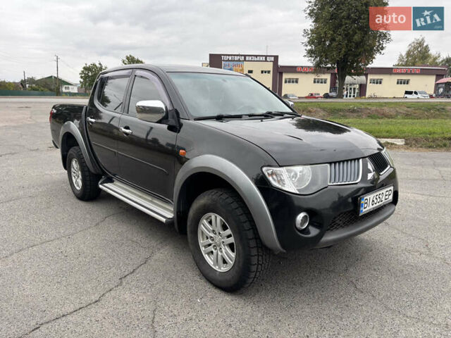 Чорний Міцубісі Л 200, об'ємом двигуна 2.5 л та пробігом 208 тис. км за 12800 $, фото 1 на Automoto.ua