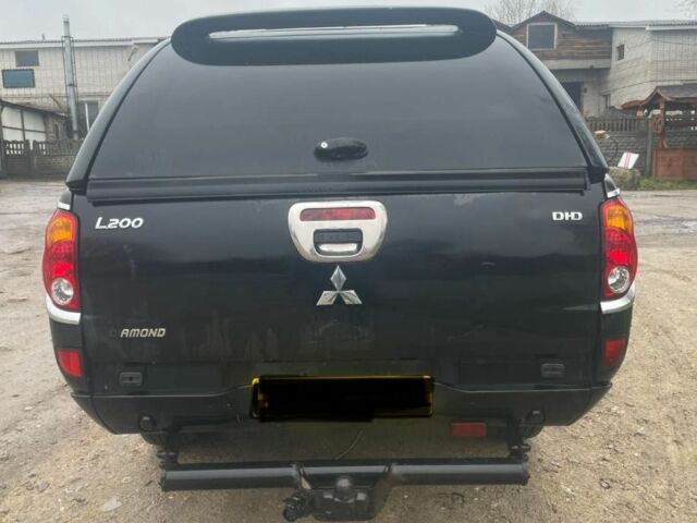 Черный Мицубиси Л 200, объемом двигателя 2.5 л и пробегом 145 тыс. км за 6800 $, фото 8 на Automoto.ua