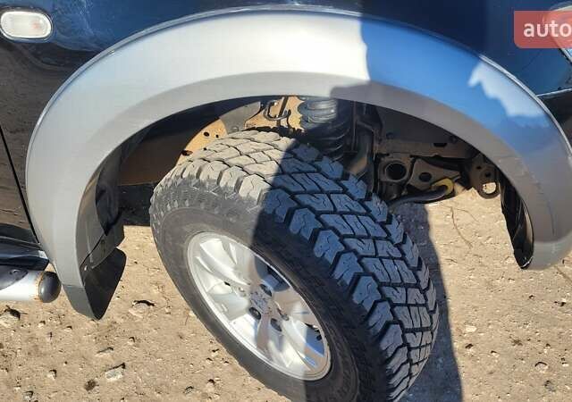 Черный Мицубиси Л 200, объемом двигателя 2.48 л и пробегом 240 тыс. км за 16000 $, фото 1 на Automoto.ua