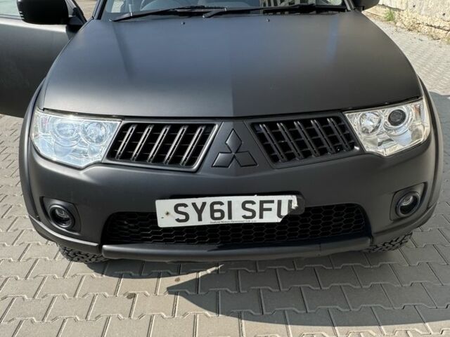 Черный Мицубиси Л 200, объемом двигателя 2.5 л и пробегом 93 тыс. км за 6600 $, фото 2 на Automoto.ua