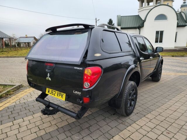 Черный Мицубиси Л 200, объемом двигателя 2.5 л и пробегом 114 тыс. км за 8748 $, фото 11 на Automoto.ua