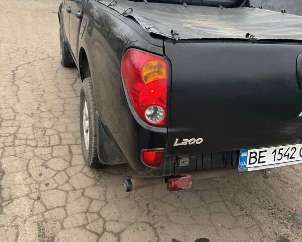 Черный Мицубиси Л 200, объемом двигателя 2.48 л и пробегом 295 тыс. км за 14800 $, фото 8 на Automoto.ua