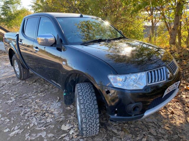 Черный Мицубиси Л 200, объемом двигателя 2.5 л и пробегом 163 тыс. км за 7600 $, фото 1 на Automoto.ua