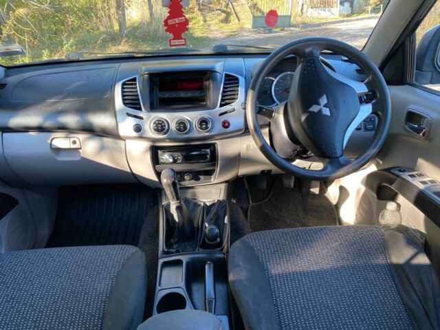 Черный Мицубиси Л 200, объемом двигателя 2.5 л и пробегом 163 тыс. км за 7600 $, фото 9 на Automoto.ua