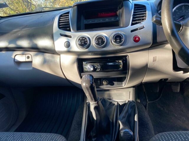 Черный Мицубиси Л 200, объемом двигателя 2.5 л и пробегом 163 тыс. км за 7600 $, фото 17 на Automoto.ua