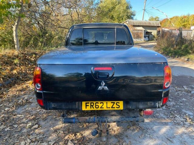 Черный Мицубиси Л 200, объемом двигателя 2.5 л и пробегом 163 тыс. км за 7600 $, фото 6 на Automoto.ua