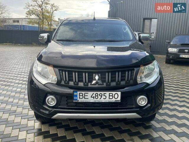 Чорний Міцубісі Л 200, об'ємом двигуна 2.4 л та пробігом 205 тис. км за 20900 $, фото 1 на Automoto.ua