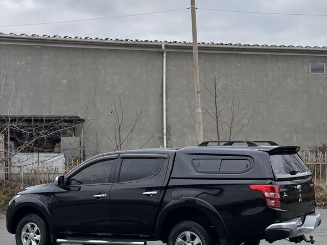 Черный Мицубиси Л 200, объемом двигателя 2.4 л и пробегом 186 тыс. км за 22200 $, фото 2 на Automoto.ua