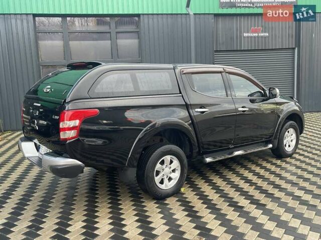 Чорний Міцубісі Л 200, об'ємом двигуна 2.4 л та пробігом 205 тис. км за 20900 $, фото 8 на Automoto.ua