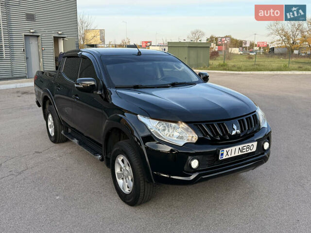 Чорний Міцубісі Л 200, об'ємом двигуна 2.44 л та пробігом 190 тис. км за 19900 $, фото 1 на Automoto.ua