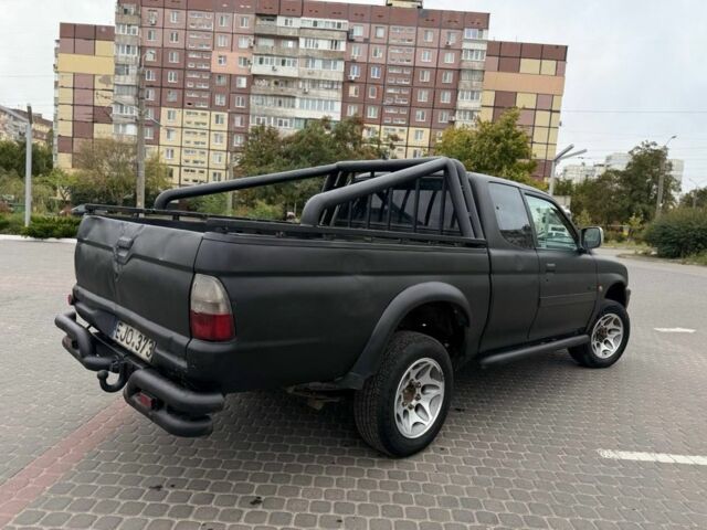 Чорний Міцубісі Л 200, об'ємом двигуна 2.5 л та пробігом 200 тис. км за 4450 $, фото 1 на Automoto.ua