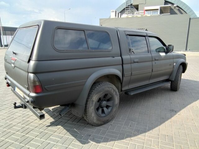 Чорний Міцубісі Л 200, об'ємом двигуна 2.5 л та пробігом 260 тис. км за 7000 $, фото 8 на Automoto.ua