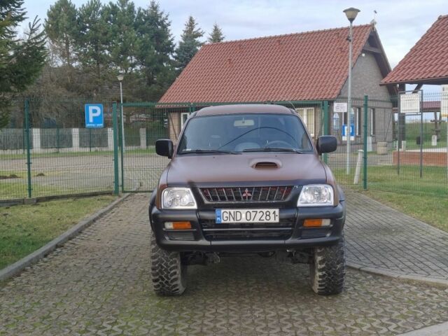 Коричневый Мицубиси Л 200, объемом двигателя 2.5 л и пробегом 194 тыс. км за 2350 $, фото 1 на Automoto.ua