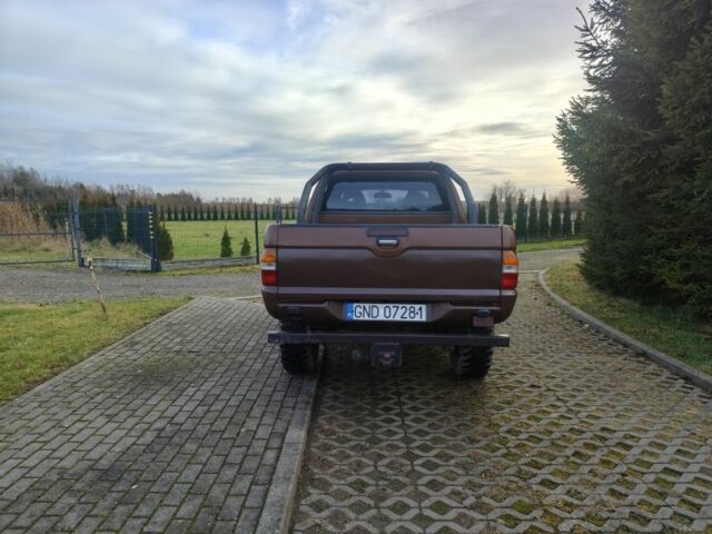 Коричневый Мицубиси Л 200, объемом двигателя 2.5 л и пробегом 194 тыс. км за 2350 $, фото 3 на Automoto.ua