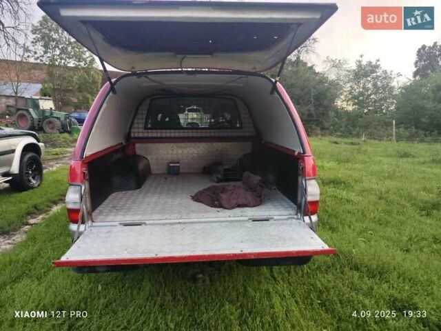 Красный Мицубиси Л 200, объемом двигателя 2.5 л и пробегом 272 тыс. км за 3200 $, фото 4 на Automoto.ua