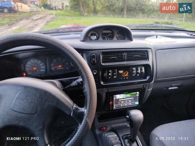 Красный Мицубиси Л 200, объемом двигателя 2.5 л и пробегом 272 тыс. км за 3200 $, фото 5 на Automoto.ua