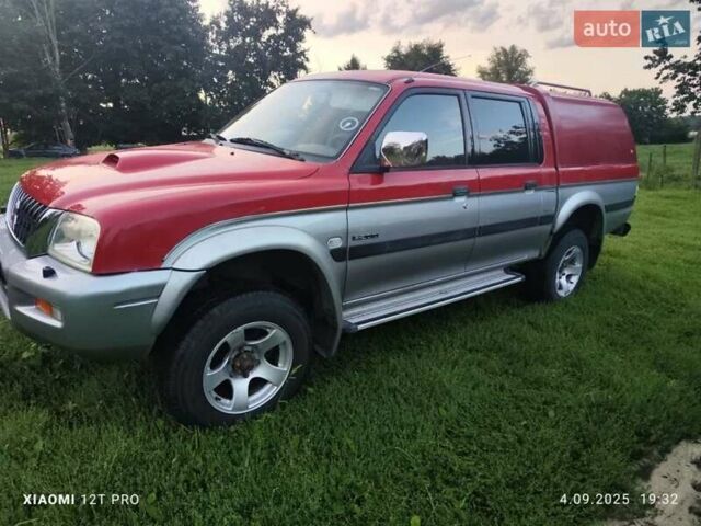 Красный Мицубиси Л 200, объемом двигателя 2.5 л и пробегом 272 тыс. км за 3200 $, фото 2 на Automoto.ua