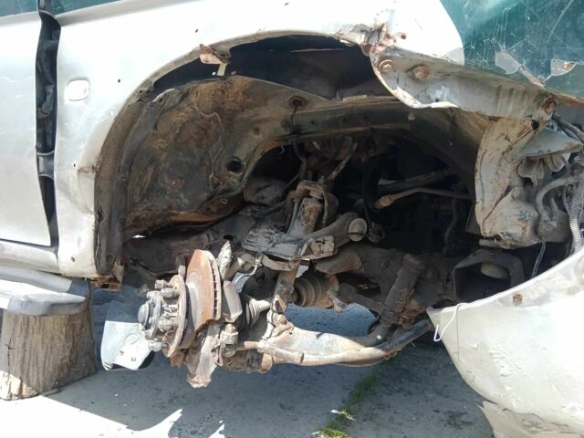 Серый Мицубиси Л 200, объемом двигателя 2.5 л и пробегом 400 тыс. км за 1000 $, фото 2 на Automoto.ua