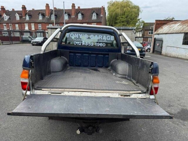 Серый Мицубиси Л 200, объемом двигателя 2.5 л и пробегом 180 тыс. км за 6200 $, фото 2 на Automoto.ua