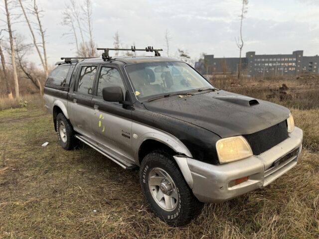 Серый Мицубиси Л 200, объемом двигателя 2.5 л и пробегом 258 тыс. км за 4500 $, фото 1 на Automoto.ua