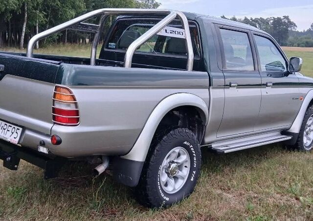 Серый Мицубиси Л 200, объемом двигателя 2.5 л и пробегом 214 тыс. км за 2600 $, фото 7 на Automoto.ua