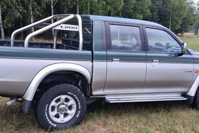 Серый Мицубиси Л 200, объемом двигателя 2.5 л и пробегом 219 тыс. км за 2650 $, фото 5 на Automoto.ua