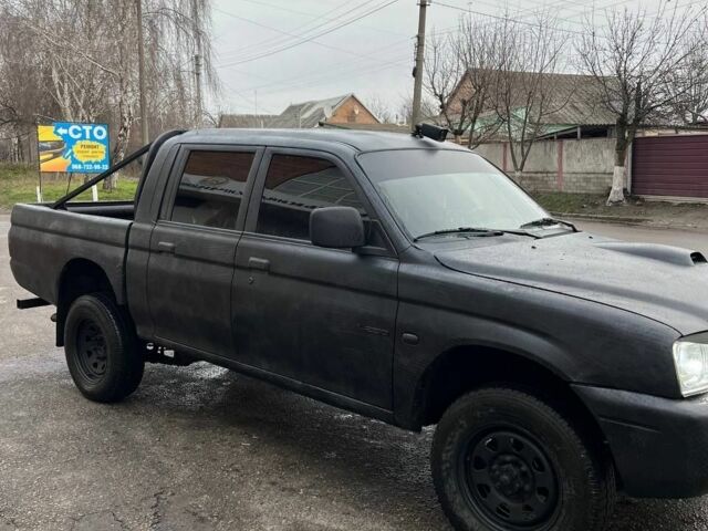 Серый Мицубиси Л 200, объемом двигателя 2.5 л и пробегом 100 тыс. км за 4700 $, фото 2 на Automoto.ua