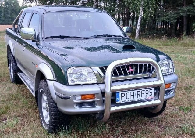 Серый Мицубиси Л 200, объемом двигателя 2.5 л и пробегом 223 тыс. км за 2550 $, фото 2 на Automoto.ua