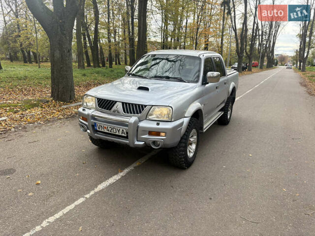 Серый Мицубиси Л 200, объемом двигателя 2.5 л и пробегом 260 тыс. км за 6669 $, фото 5 на Automoto.ua