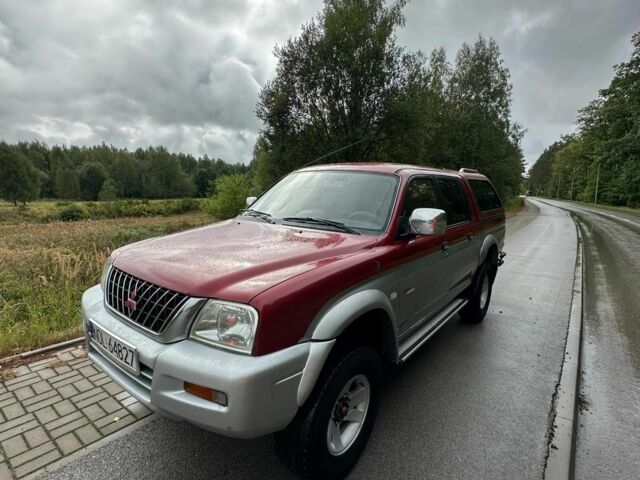 Серый Мицубиси Л 200, объемом двигателя 2 л и пробегом 245 тыс. км за 5241 $, фото 2 на Automoto.ua