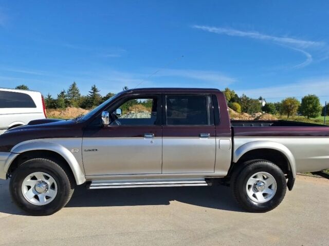 Серый Мицубиси Л 200, объемом двигателя 2.5 л и пробегом 244 тыс. км за 2650 $, фото 2 на Automoto.ua