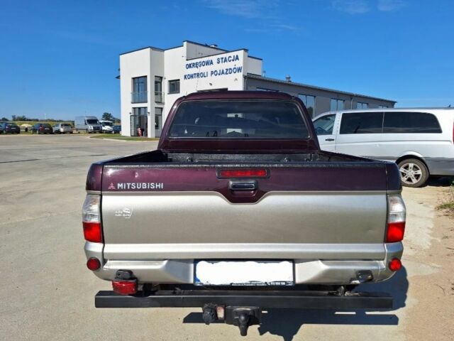 Серый Мицубиси Л 200, объемом двигателя 2.5 л и пробегом 244 тыс. км за 2650 $, фото 5 на Automoto.ua