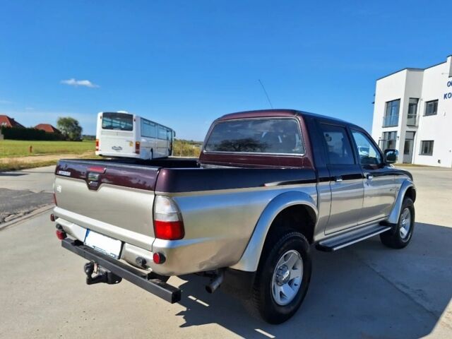 Серый Мицубиси Л 200, объемом двигателя 2.5 л и пробегом 244 тыс. км за 2650 $, фото 3 на Automoto.ua