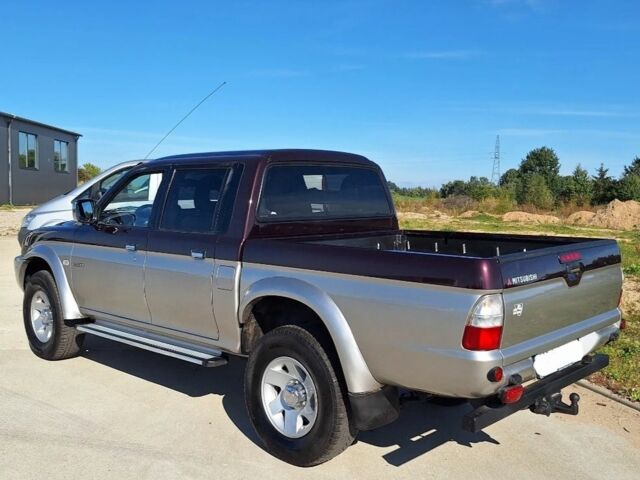 Серый Мицубиси Л 200, объемом двигателя 2.5 л и пробегом 247 тыс. км за 2600 $, фото 3 на Automoto.ua