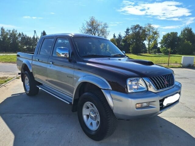 Серый Мицубиси Л 200, объемом двигателя 2.5 л и пробегом 244 тыс. км за 2650 $, фото 1 на Automoto.ua