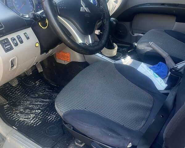 Серый Мицубиси Л 200, объемом двигателя 2.48 л и пробегом 250 тыс. км за 13500 $, фото 11 на Automoto.ua