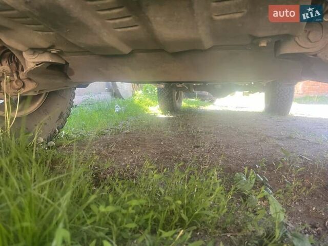 Серый Мицубиси Л 200, объемом двигателя 2.48 л и пробегом 250 тыс. км за 13500 $, фото 3 на Automoto.ua