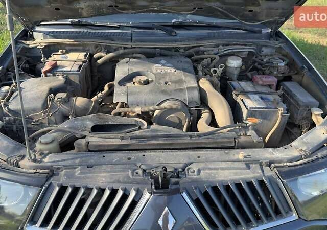 Серый Мицубиси Л 200, объемом двигателя 2.48 л и пробегом 234 тыс. км за 13000 $, фото 38 на Automoto.ua