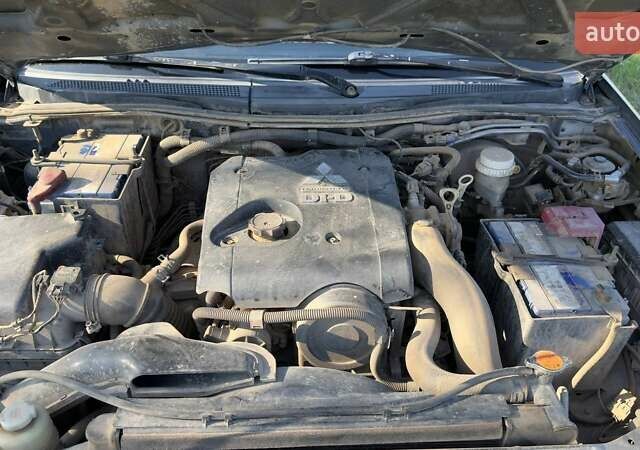 Серый Мицубиси Л 200, объемом двигателя 2.48 л и пробегом 234 тыс. км за 13000 $, фото 39 на Automoto.ua