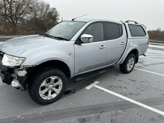 Серый Мицубиси Л 200, объемом двигателя 2.5 л и пробегом 155 тыс. км за 7888 $, фото 5 на Automoto.ua