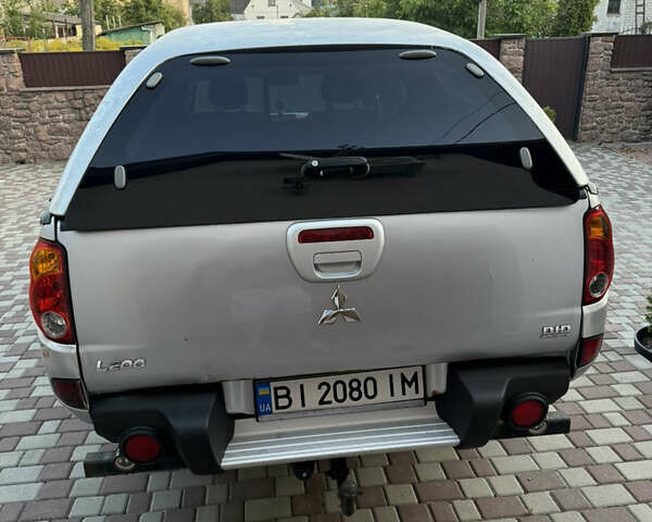 Серый Мицубиси Л 200, объемом двигателя 2.5 л и пробегом 280 тыс. км за 13000 $, фото 21 на Automoto.ua