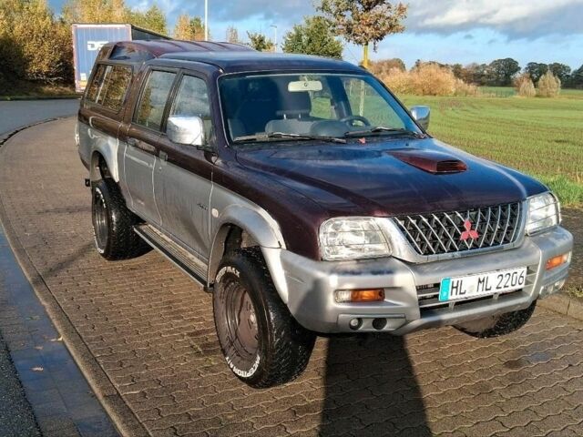 Серый Мицубиси Л 200, объемом двигателя 2.5 л и пробегом 183 тыс. км за 2500 $, фото 1 на Automoto.ua