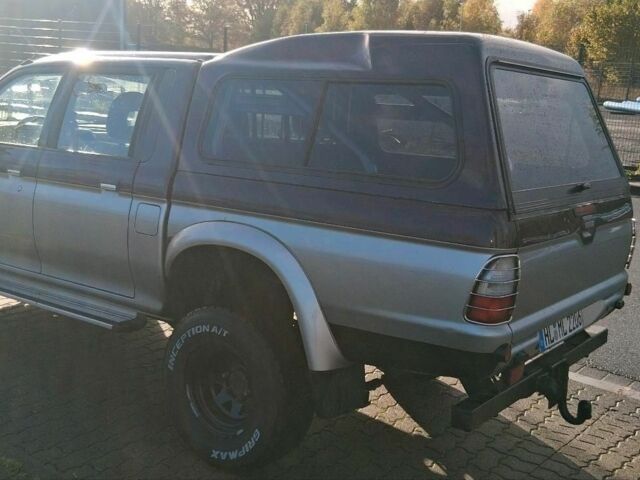 Серый Мицубиси Л 200, объемом двигателя 2.5 л и пробегом 183 тыс. км за 2500 $, фото 3 на Automoto.ua